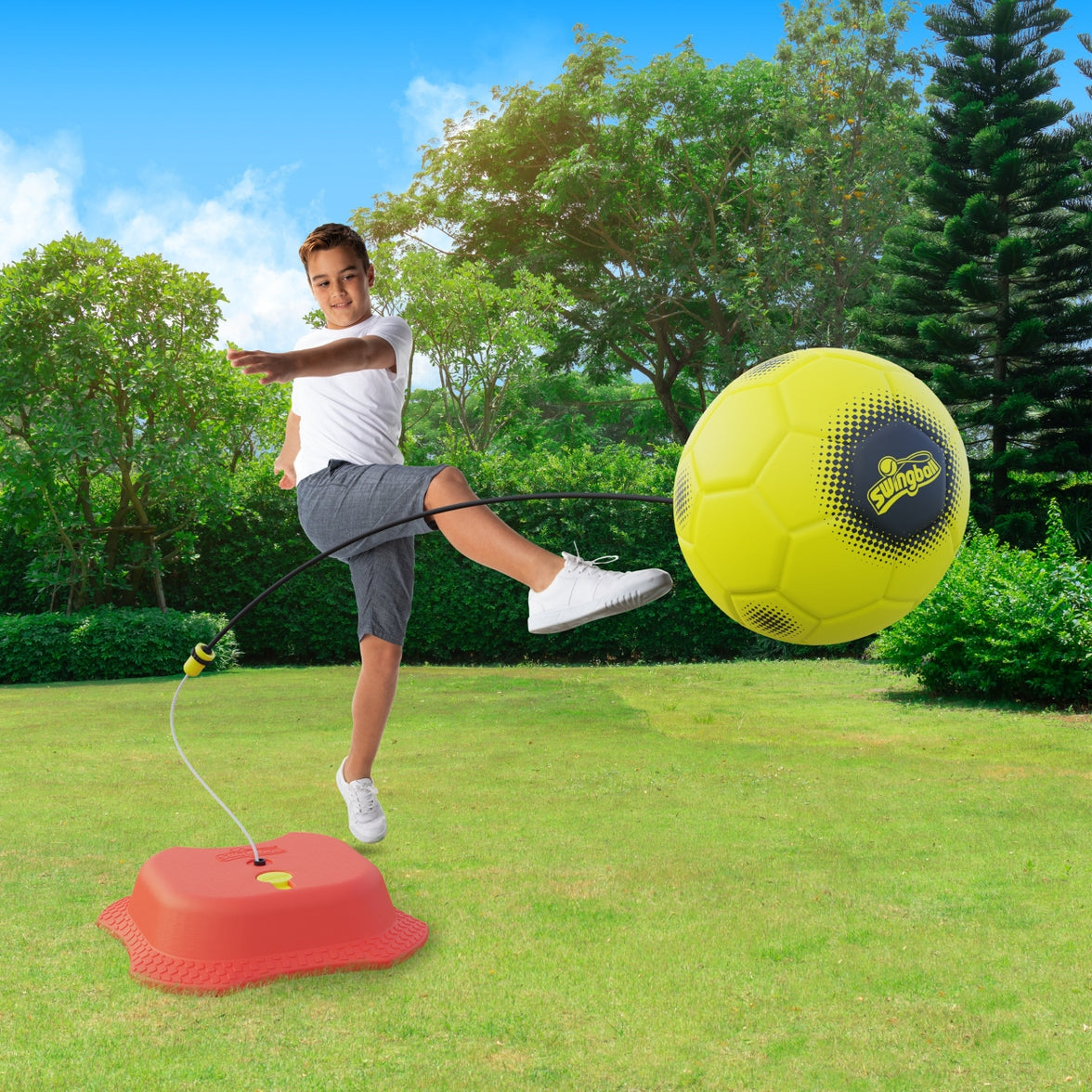 Model image of kid kicking the soccer ball but ball is shown to be connected to the string.