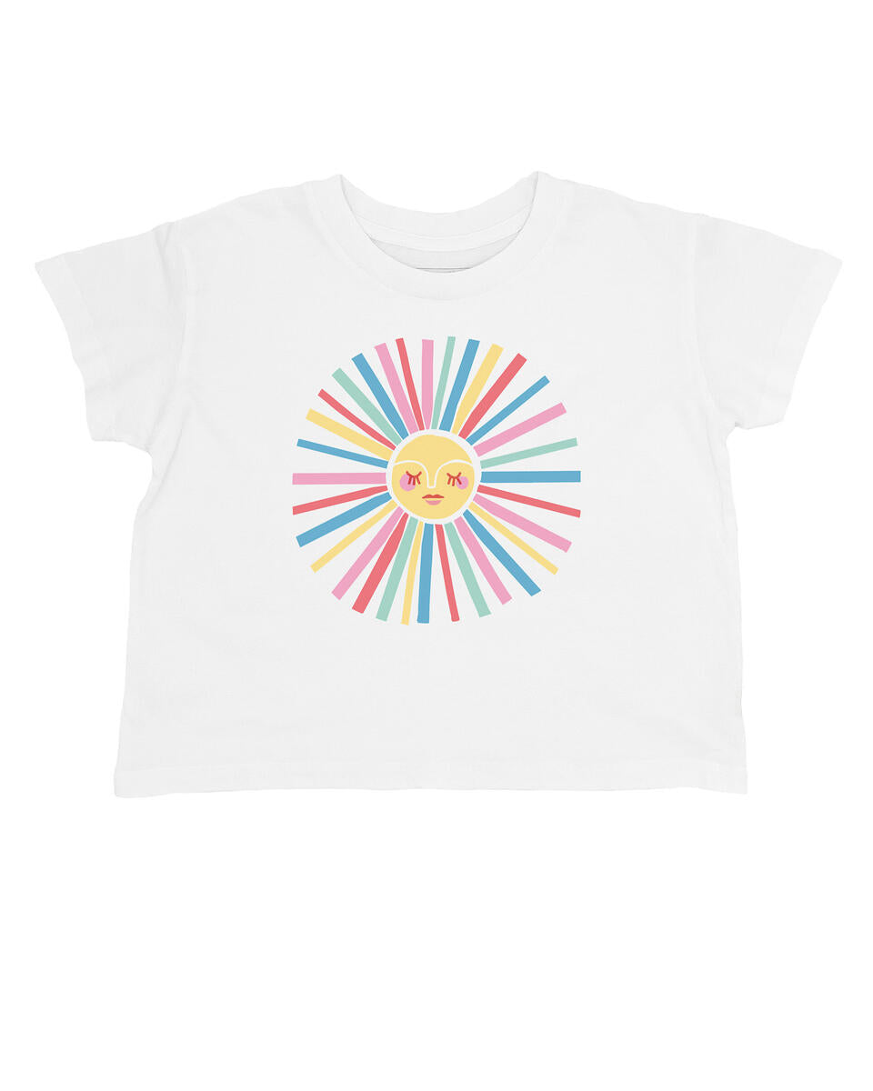 White cropped t-shirt with a sun design on the front in rainbow coloring