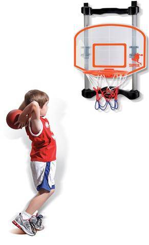 Image of kid throwing a basketball into a hoop that is over the door.