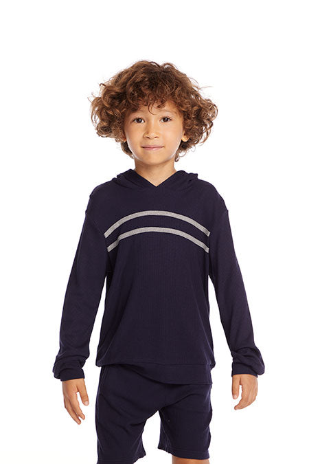 Model image of a black pullover and short set. Pullover has two stripes across the front