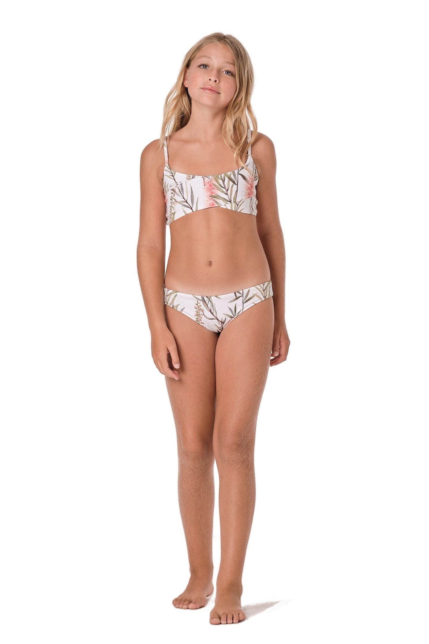 Model image of bikini set. Design is white with floral/paradise look.
