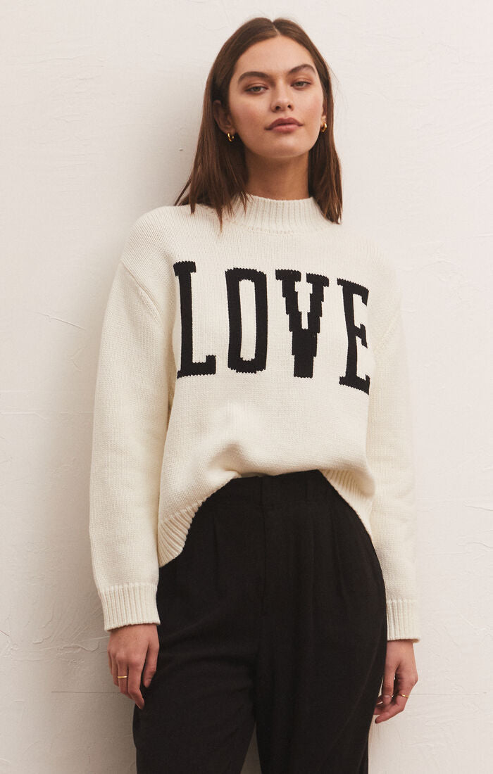 Pullover sweater in white with LOVE printed on the front in black
