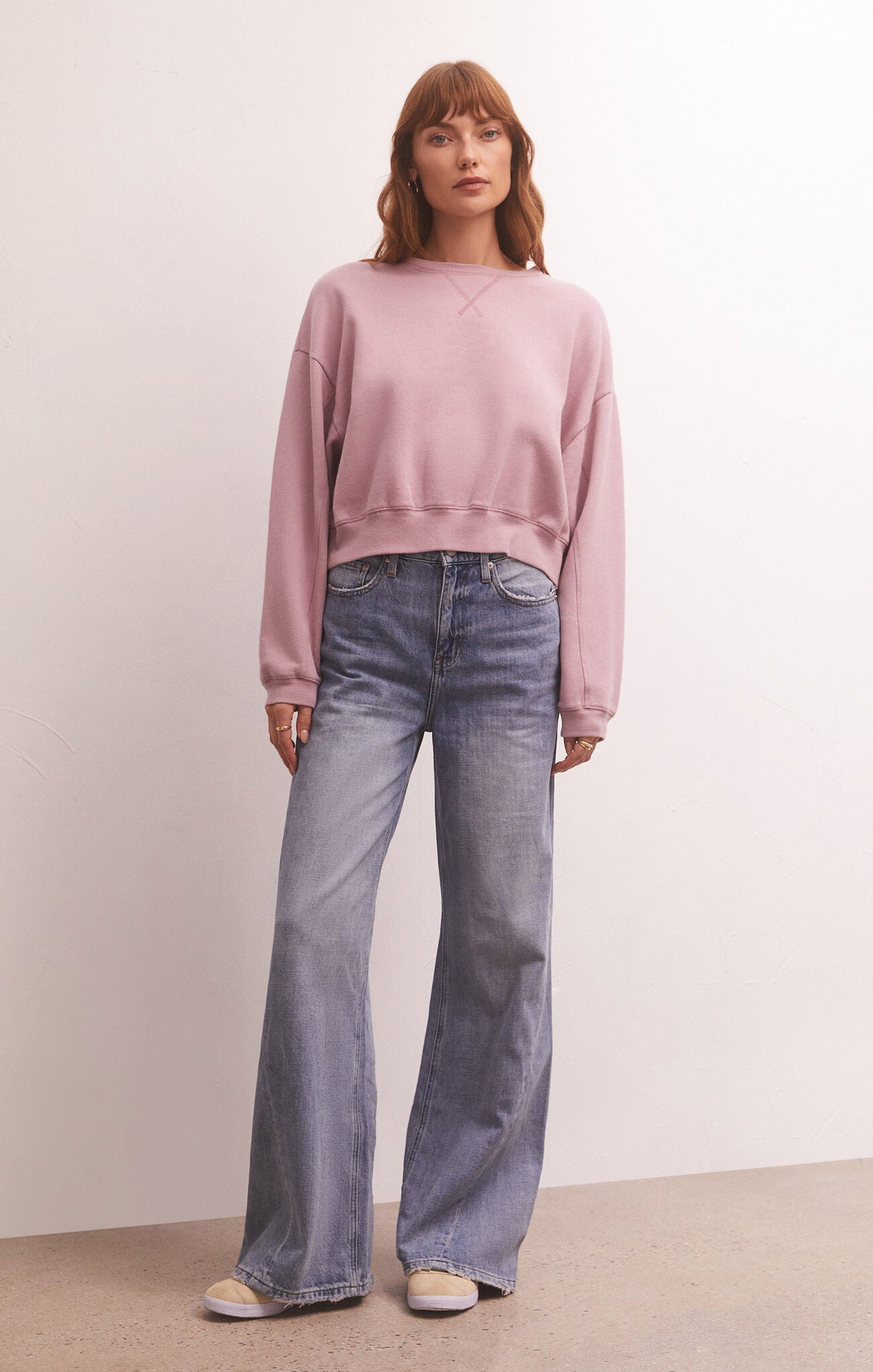 Model image of crewneck in pink wearing jeans